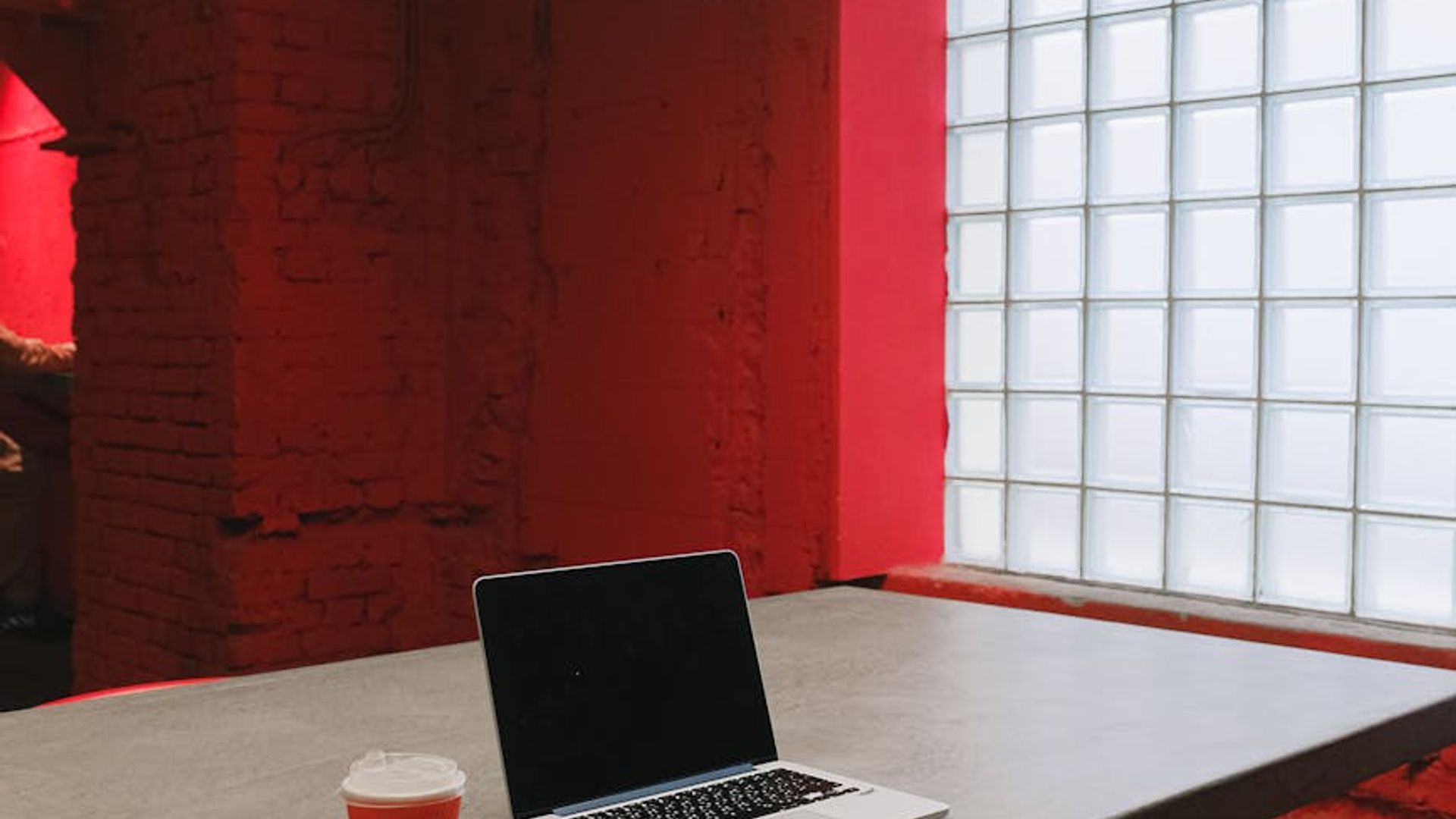 Modern office workspace with soft red lighting accents
